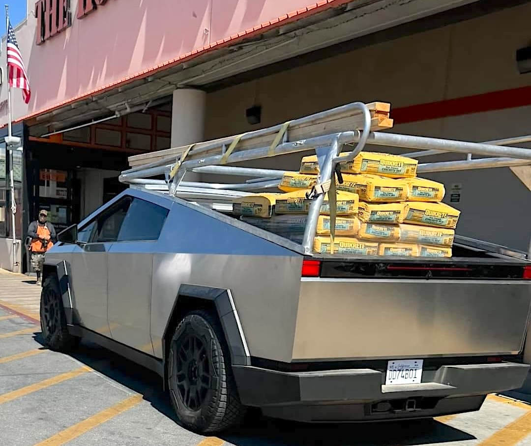 Cybertruck work truck with custom Pipe / Ladder / Lumber Rack putting ...